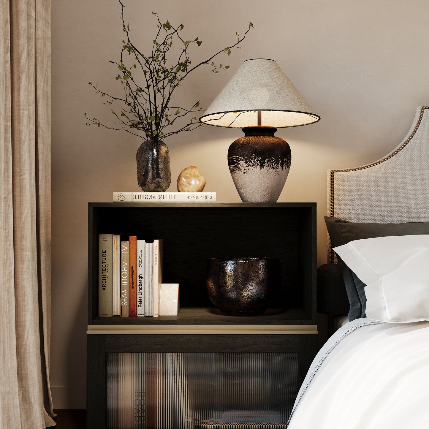 Two stacked black basic cabinets form a classic retro bedside table in the bedroom.