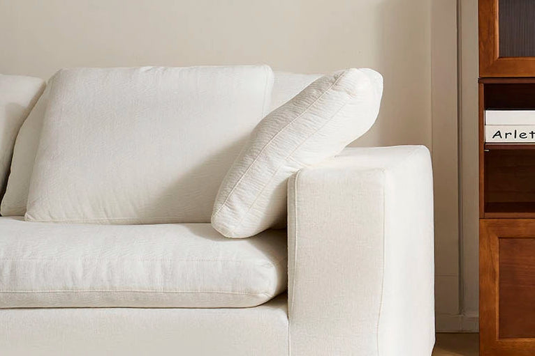 Showing fabric details of the white modular sofa.