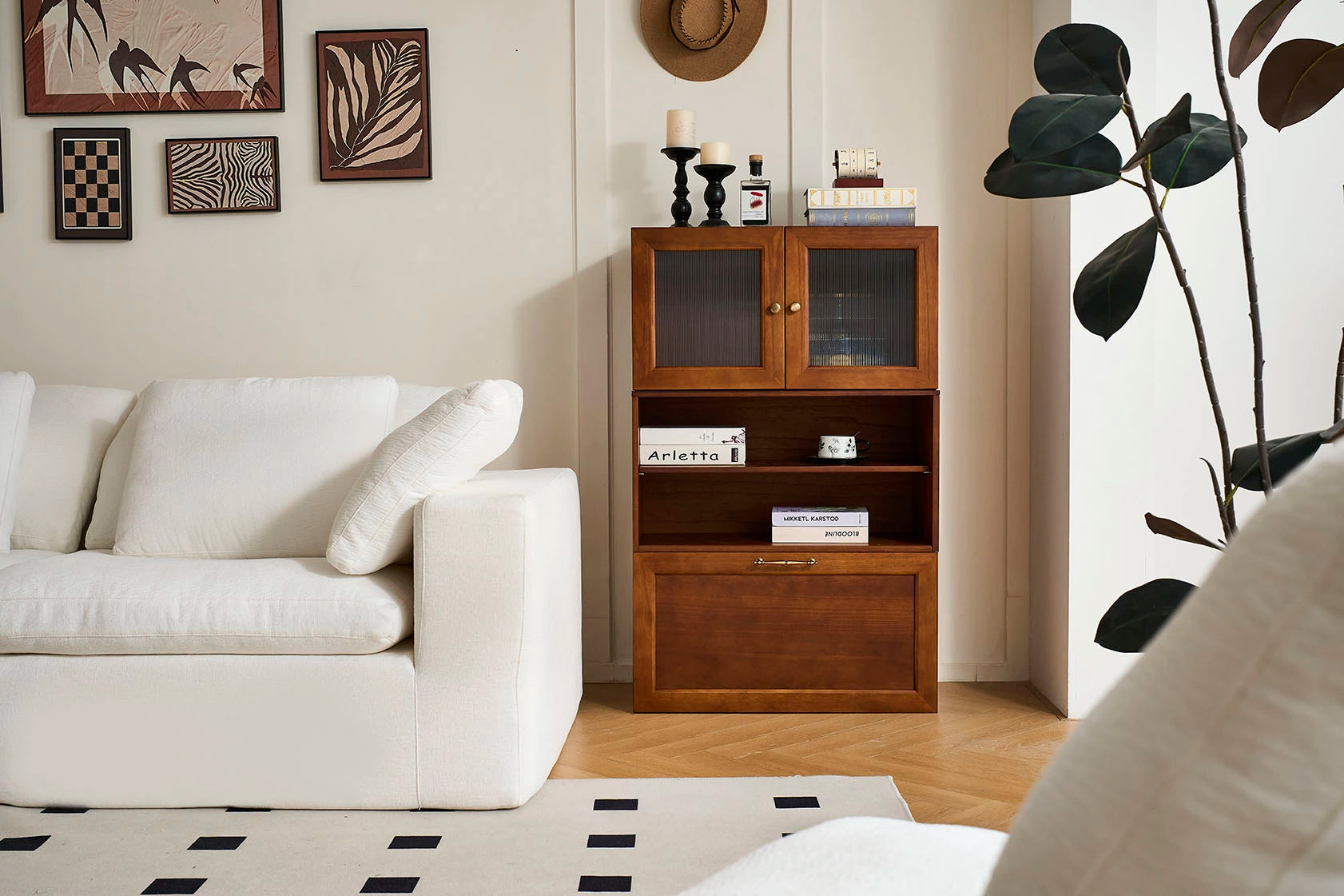 Cozy Nest's medieval-style living room features a walnut-colored modular base cabinet paired with a three-drawer chest.