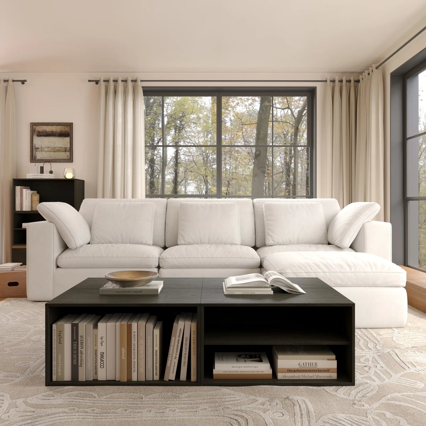 The modern and simple open living room is furnished with a white modular four-seater L-shaped sofa and a coffee table and chest of drawers consisting of black modular basic cabinets.