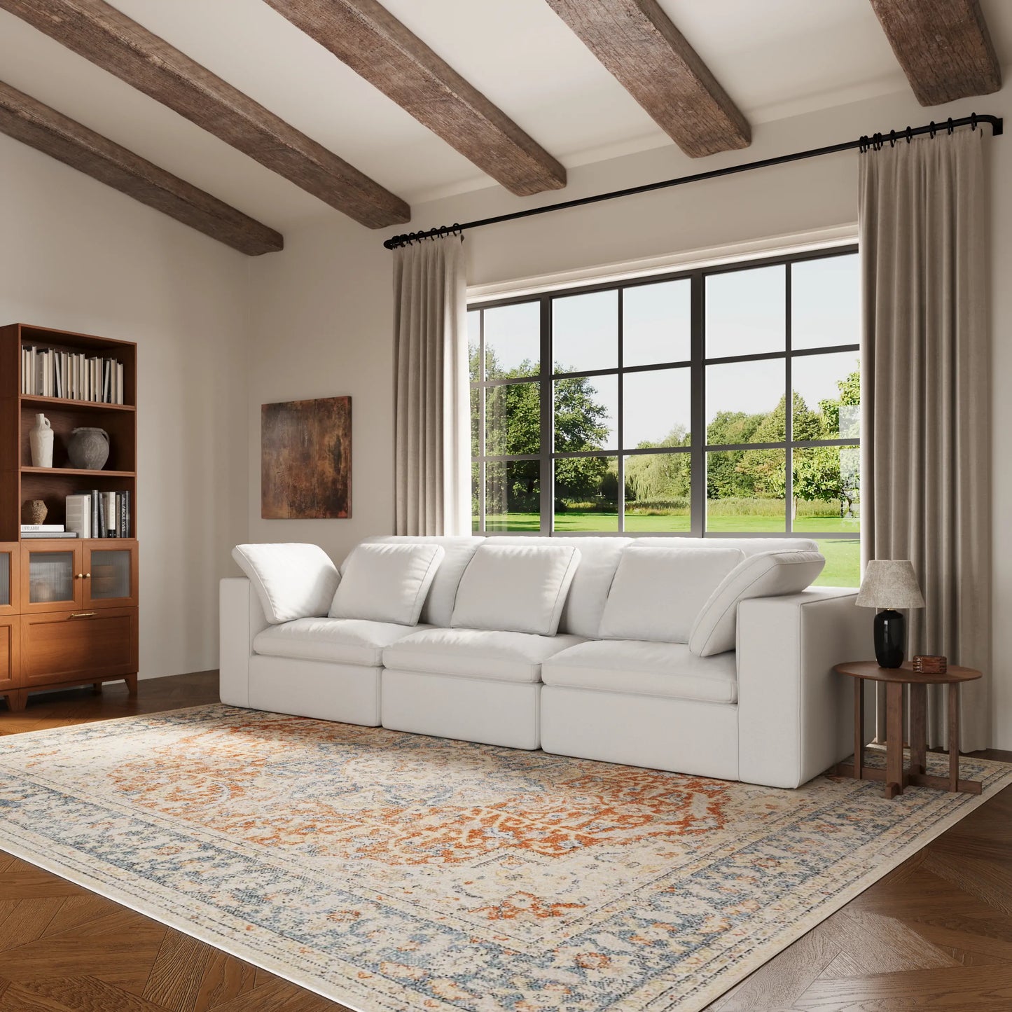 A set of white modular four-seater L-shaped sofas in the living room.