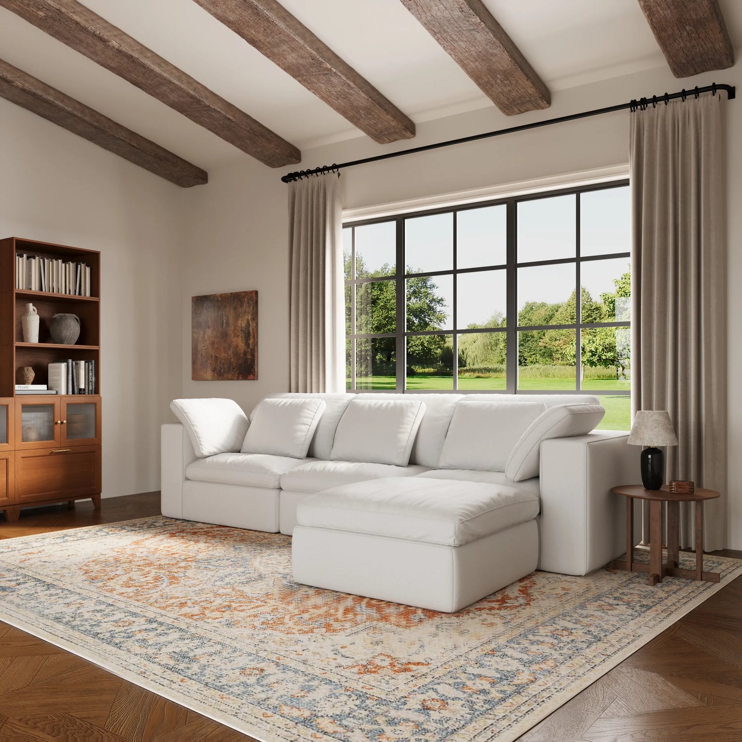 A set of white modular four-seater L-shaped sofas in the living room.