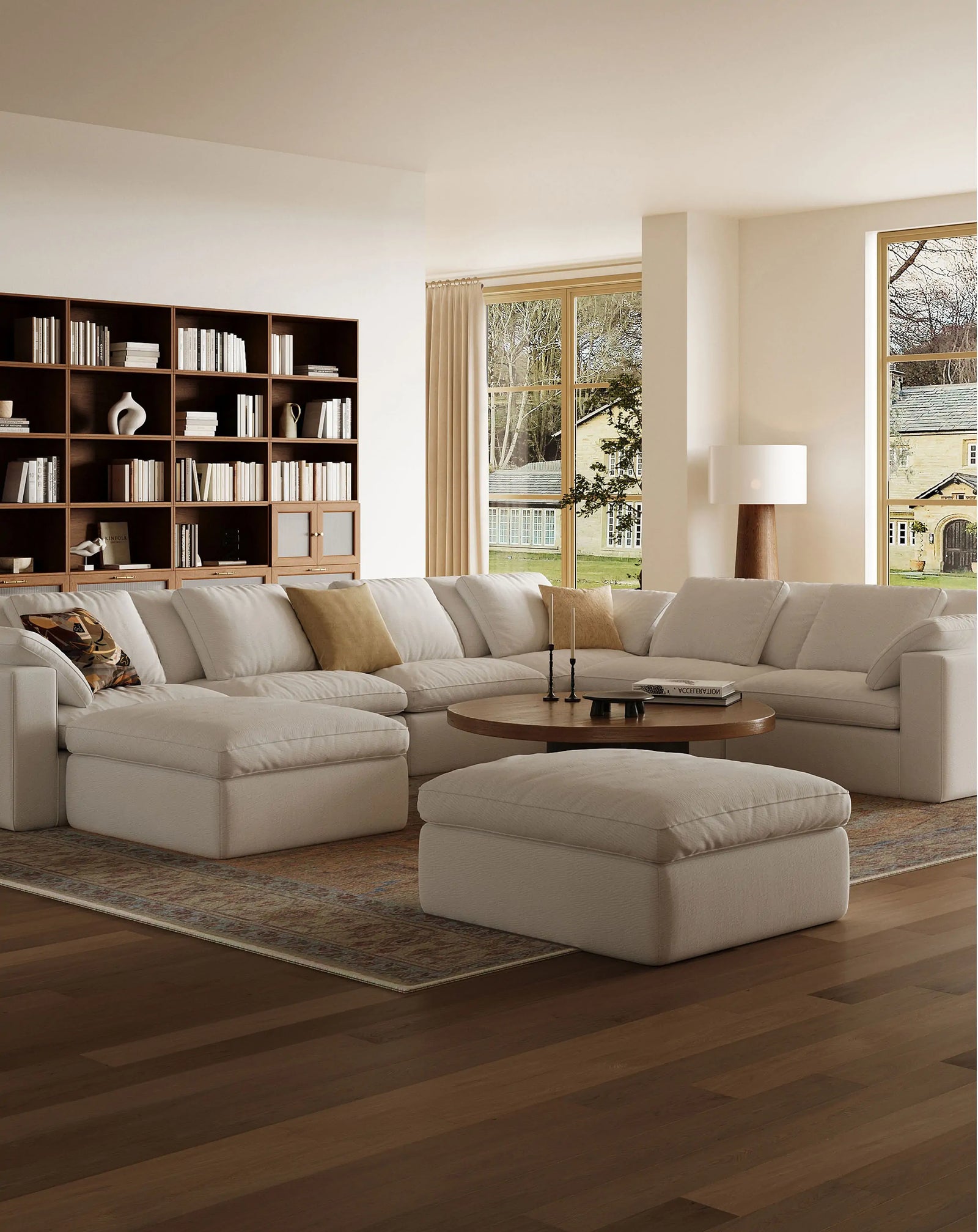 The living room features eight white modular sofas arranged in a wraparound configuration.