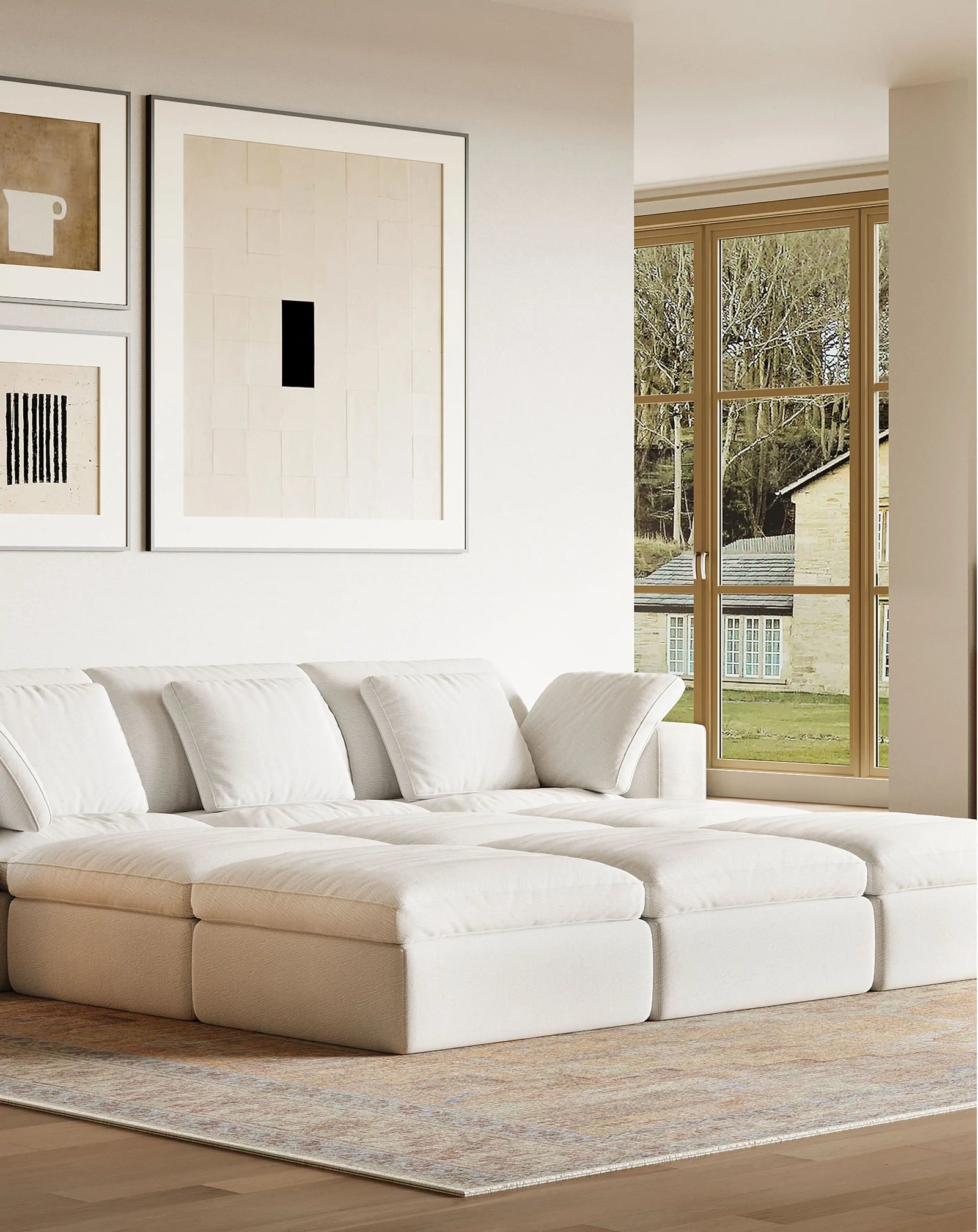 The living room features nine white modular sofas arranged to act as beds.