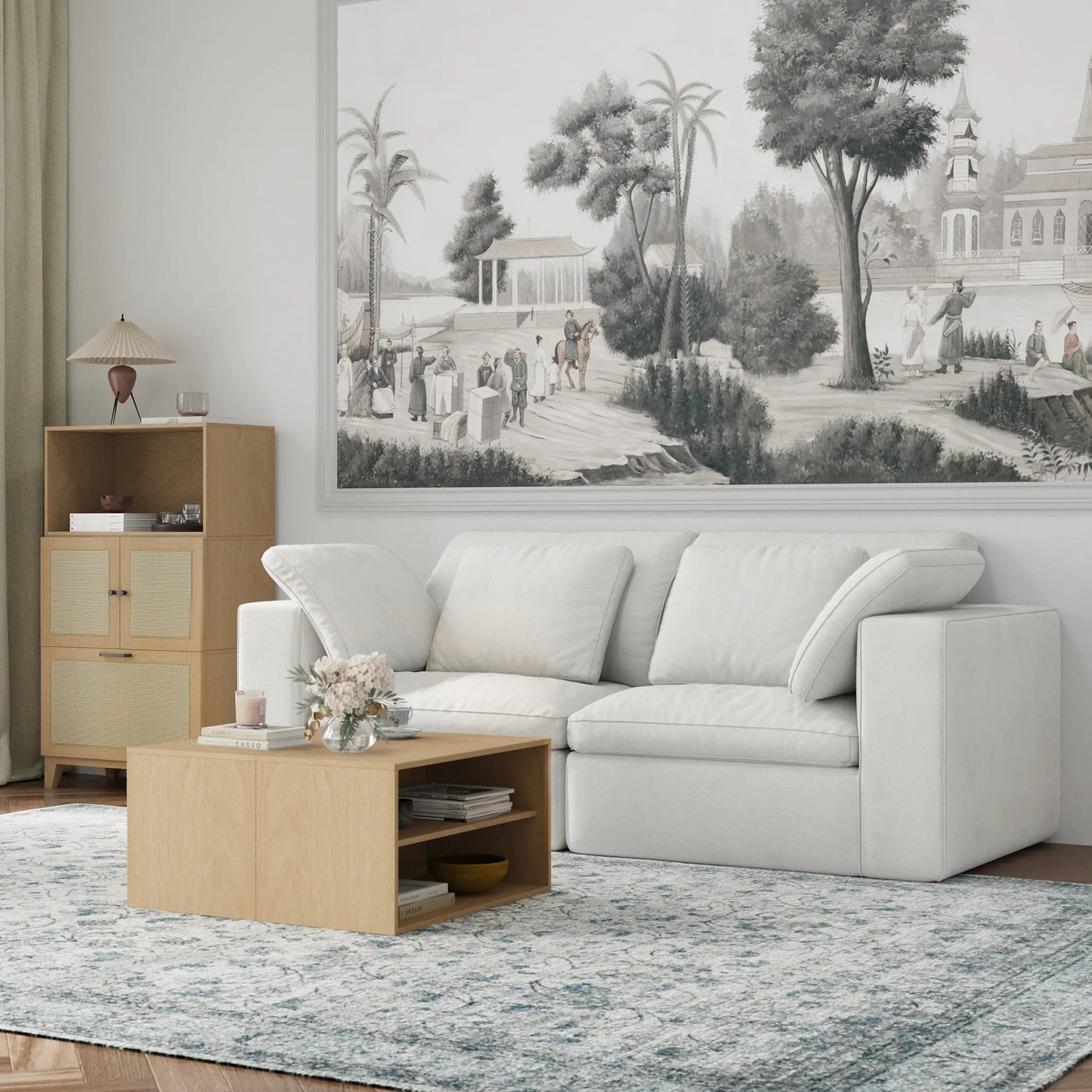 The modern and simple living room is furnished with a modular double sofa, a modular natural wood coffee table and a three-drawer chest.