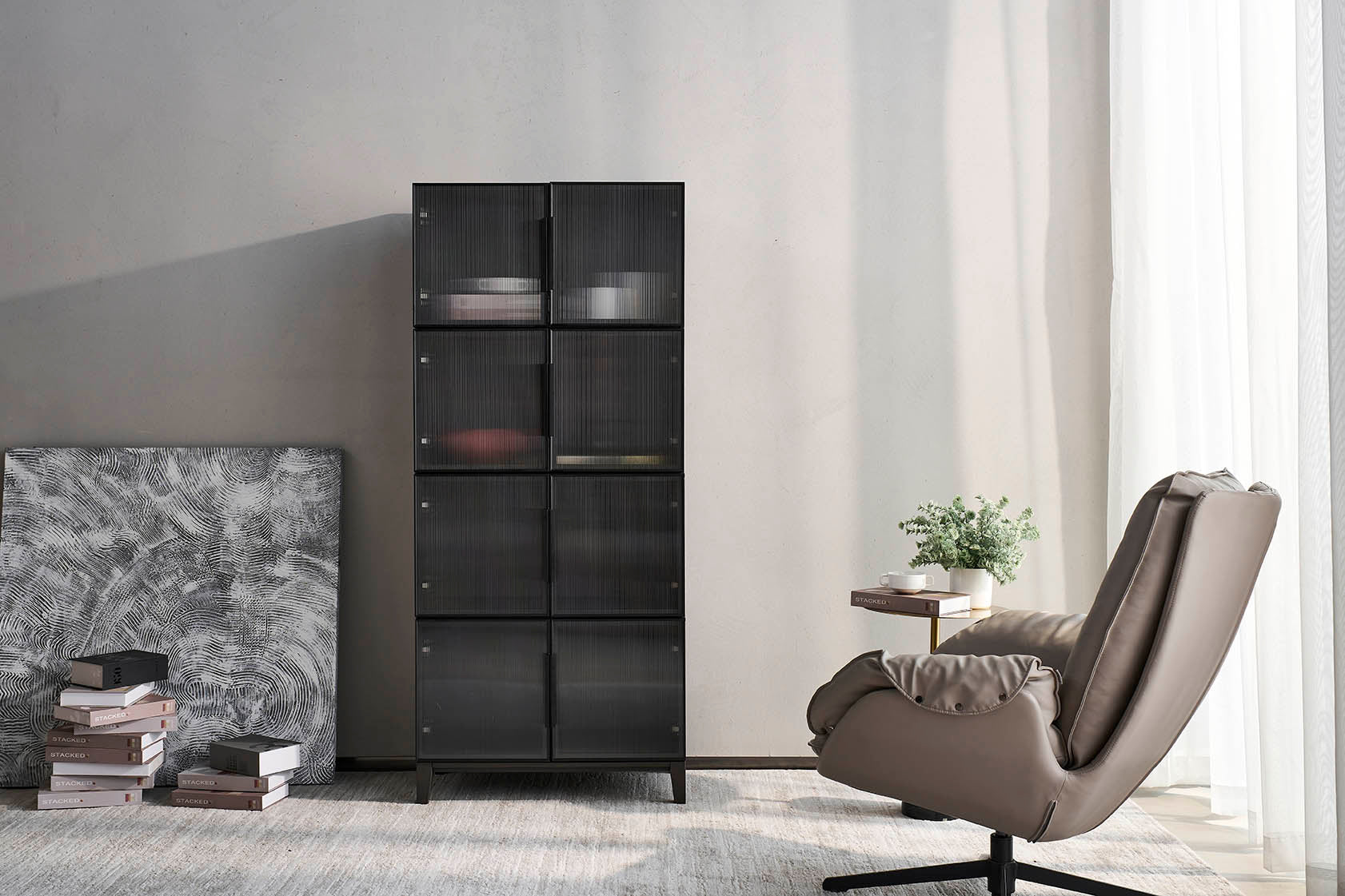 The cozy nest Italian minimalist black 4-drawer chest is equipped with translucent double doors.