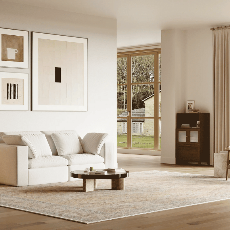The living room has a double-seater sofa set consisting of two white modular sofas, which can be changed into more different sofa combinations.